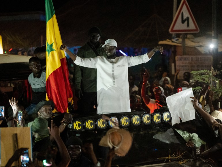 FILE PHOTO: Presidential candidate Bassirou Diomaye Faye cheers on supporters during his electoral campaign caravan in Zinguinchor, Casmance, Senegal March 16, 2024. REUTERS/Abdou Karim Ndoye/File Photo